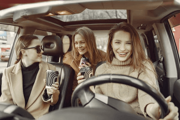 women inside a car